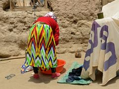 18 Woman Washing Clothes In Yilik Village On The Way To K2 China Trek.jpg